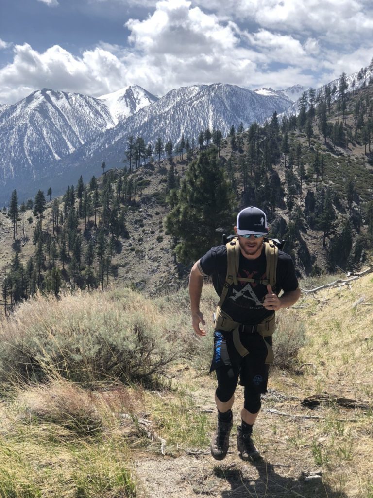 Wilderness Athlete running on mountain for posterior chain training